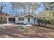 Charming single-story home with white painted brick, covered porch, and carport at 2695 Terratim Ln, Decatur, GA 30034