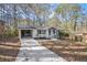 Charming one-story home featuring a well-maintained front yard and a convenient carport at 2695 Terratim Ln, Decatur, GA 30034