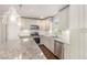Close-up of kitchen featuring stainless steel appliances, granite countertops, and custom cabinets at 2695 Terratim Ln, Decatur, GA 30034