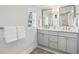 Stylish bathroom with double sink vanity, marble countertops, and modern fixtures for a luxurious feel at 2923 Ridgemore Nw Rd, Atlanta, GA 30318