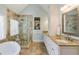 Bathroom featuring a glass shower, granite countertops, cabinets, and natural light from the large window at 4155 Park Brooke Dr, Alpharetta, GA 30022