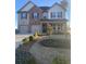 Two-story home featuring a symmetrical design with a brick and siding exterior, complemented by well-maintained landscaping at 736 Great Oak Pl, Villa Rica, GA 30180