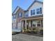 Inviting two-story home with a mix of brick and siding, featuring a double garage and meticulously landscaped front garden at 736 Great Oak Pl, Villa Rica, GA 30180