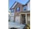 Classic two-story home showcasing a combination of brick and siding, complete with an attached two-car garage and neat landscaping at 736 Great Oak Pl, Villa Rica, GA 30180