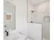 Modern bathroom with a glass enclosed shower featuring marble tile and black fixtures at 1096 Glen Opal Dr, Decatur, GA 30032