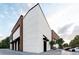 Modern building exterior featuring mixed facade with white masonry and wooden accents under a blue sky at 1096 Glen Opal Dr, Decatur, GA 30032
