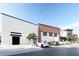 Contemporary building exterior showcasing white and wooden facade, alongside luxury car parking and landscaping at 1096 Glen Opal Dr, Decatur, GA 30032