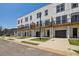 Townhome exterior features front garages, a modern design, and individual balconies at 1096 Glen Opal Dr, Decatur, GA 30032