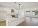 Kitchen with quartz countertops, stainless steel appliances and modern pendant lighting at 1096 Glen Opal Dr, Decatur, GA 30032