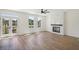 Bright living room features wood floors, fireplace, ceiling fan and balcony access at 1096 Glen Opal Dr, Decatur, GA 30032