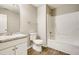 Bright bathroom with a tub shower, vanity, and toilet at 2921 Russ Ln, Lithonia, GA 30058