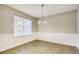Dining room with a chandelier, chair rail, and hard surface floor at 2921 Russ Ln, Lithonia, GA 30058