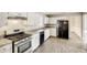 Functional kitchen with stainless steel appliances, sleek counters, and ample cabinet space at 2921 Russ Ln, Lithonia, GA 30058
