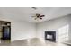Bright living room with a decorative fireplace and wood-look flooring at 2921 Russ Ln, Lithonia, GA 30058