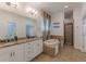 Bathroom includes double sink vanity, soaking tub and walk-in shower at 3529 S Sherwood Se Rd, Smyrna, GA 30082