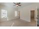 Bedroom featuring a ceiling fan, neutral walls and carpet, and natural light from windows at 3529 S Sherwood Se Rd, Smyrna, GA 30082