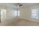 Bright, neutral bedroom featuring large windows, plush carpeting, and ample natural light at 3529 S Sherwood Se Rd, Smyrna, GA 30082
