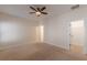 Bedroom featuring neutral walls, ceiling fan, and door to a walk-in closet at 3529 S Sherwood Se Rd, Smyrna, GA 30082