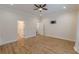 Bedroom features hardwood floors, ceiling fan, shuttered window and two doorway access points at 3529 S Sherwood Se Rd, Smyrna, GA 30082