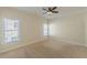 Bedroom featuring two windows, neutral wall-to-wall carpet and blinds at 3529 S Sherwood Se Rd, Smyrna, GA 30082