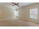 Bedroom with a ceiling fan, windows, neutral walls and carpet, and ample space at 3529 S Sherwood Se Rd, Smyrna, GA 30082
