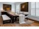 Traditional dining room with dark wood table, shuttered windows, and decorative paintings at 3529 S Sherwood Se Rd, Smyrna, GA 30082