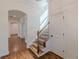 Hallway features hardwood floors, an archway, and a carpeted staircase at 3529 S Sherwood Se Rd, Smyrna, GA 30082
