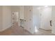 Bright hallway with carpet flooring, white trim, and a view of the staircase at 3529 S Sherwood Se Rd, Smyrna, GA 30082