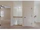 Upstairs hallway with neutral carpet, crown molding, and access to several bedrooms at 3529 S Sherwood Se Rd, Smyrna, GA 30082