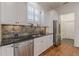 Modern kitchen with stainless steel appliances, granite countertops, and ample natural light at 3529 S Sherwood Se Rd, Smyrna, GA 30082