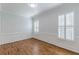 Spacious living room showcasing hardwood floors, modern trim, and plenty of natural light at 3529 S Sherwood Se Rd, Smyrna, GA 30082