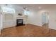 Living room boasting a fireplace with built-in shelving, hardwood floors, and recessed lighting at 3529 S Sherwood Se Rd, Smyrna, GA 30082