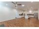 Expansive living area with hardwood floors flowing into a modern kitchen with white cabinetry at 3529 S Sherwood Se Rd, Smyrna, GA 30082
