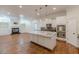 Open-concept living area, adjacent to kitchen, features hardwood floors and ample space for gatherings at 3529 S Sherwood Se Rd, Smyrna, GA 30082