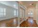 Bright living room featuring hardwood floors, large windows, and elegant trimwork throughout at 3529 S Sherwood Se Rd, Smyrna, GA 30082