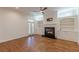 Comfortable living area with fireplace, built-in shelving, and natural light at 3529 S Sherwood Se Rd, Smyrna, GA 30082