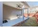The covered patio includes a ceiling fan, stone trim, and rocking chairs at 3529 S Sherwood Se Rd, Smyrna, GA 30082
