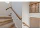 Carpeted staircase with wooden handrails at 3529 S Sherwood Se Rd, Smyrna, GA 30082