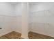 Walk-in closet with white shelving and laminate flooring at 3529 S Sherwood Se Rd, Smyrna, GA 30082