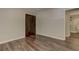 Bedroom with wood-look floors and barn-style closet doors at 616 Rich Davis Rd, Hiram, GA 30141