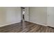Neutral bedroom with wood-look floors and white trim at 616 Rich Davis Rd, Hiram, GA 30141