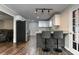 Modern kitchen with a breakfast bar, stainless steel appliances, and ample counter space for meal preparation at 616 Rich Davis Rd, Hiram, GA 30141