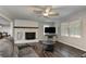 Bright living room with a fireplace, hardwood floors, a ceiling fan, and neutral paint at 616 Rich Davis Rd, Hiram, GA 30141