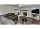 Bright living room with a ceiling fan, hardwood floors, a fireplace, and neutral paint at 616 Rich Davis Rd, Hiram, GA 30141