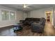 Cozy living room features dark floors, neutral walls, and comfortable seating, ideal for relaxation at 616 Rich Davis Rd, Hiram, GA 30141