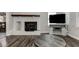 Bright living room with painted fireplace, modern flooring, and a decorative mantel for added charm at 616 Rich Davis Rd, Hiram, GA 30141