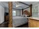 Spacious main bedroom featuring a four-poster bed, wood floors, and natural light at 616 Rich Davis Rd, Hiram, GA 30141