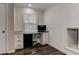 Office area featuring white cabinets, wood floors, natural light, and granite countertops at 616 Rich Davis Rd, Hiram, GA 30141