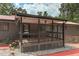 Covered porch with railing, providing outdoor living space with easy access to the backyard and pool area at 616 Rich Davis Rd, Hiram, GA 30141