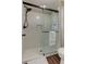 Newly renovated bathroom with tiled shower, glass door, and modern fixtures at 616 Rich Davis Rd, Hiram, GA 30141